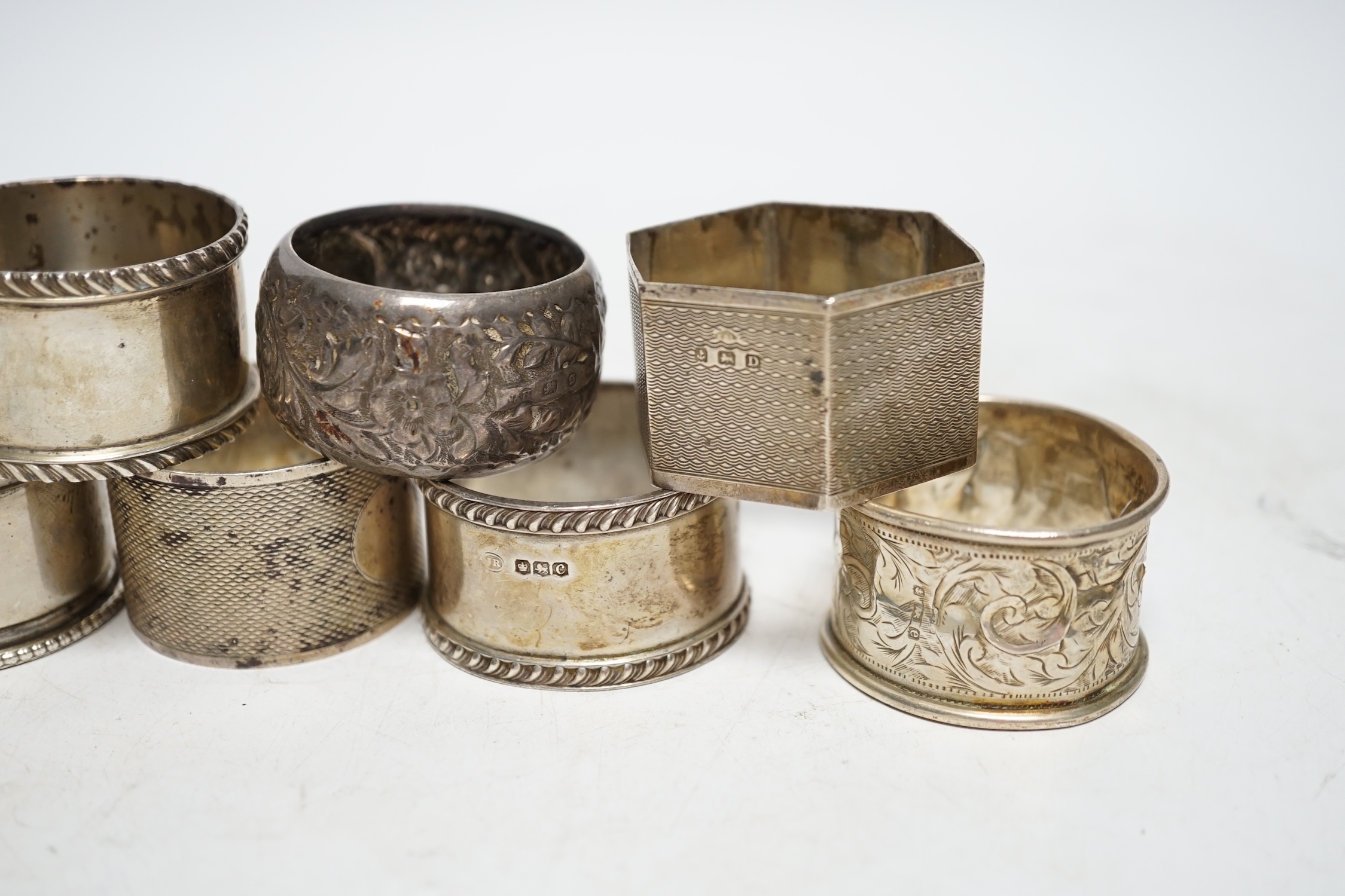 Eleven assorted early 20th century and later silver napkin rings, various dates and makers, 9.2oz. Poor to fair condition.